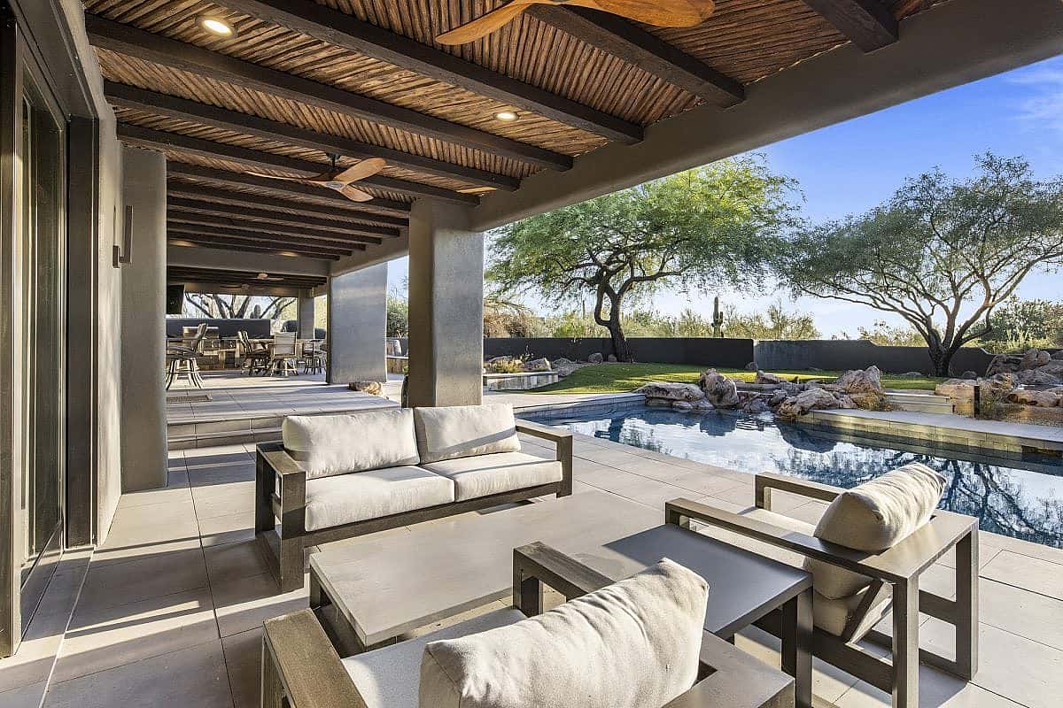 Set within the exclusive Desert Highlands golf community, this modern home is teeming with amenities for the ultimate Southwestern lifestyle.