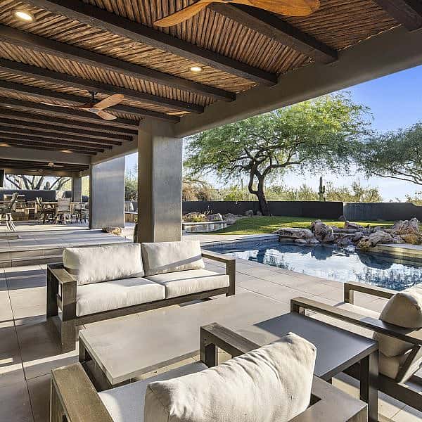 Set within the exclusive Desert Highlands golf community, this modern home is teeming with amenities for the ultimate Southwestern lifestyle.