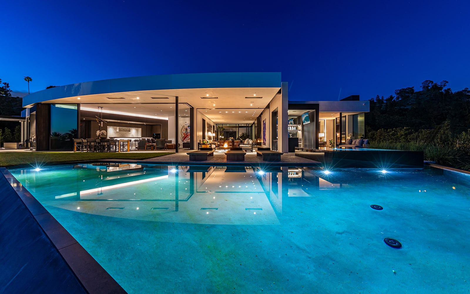 swimming pool nightime beverly hills luxury home