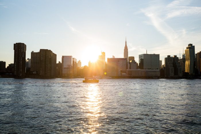 sunset over east river new york city skyline