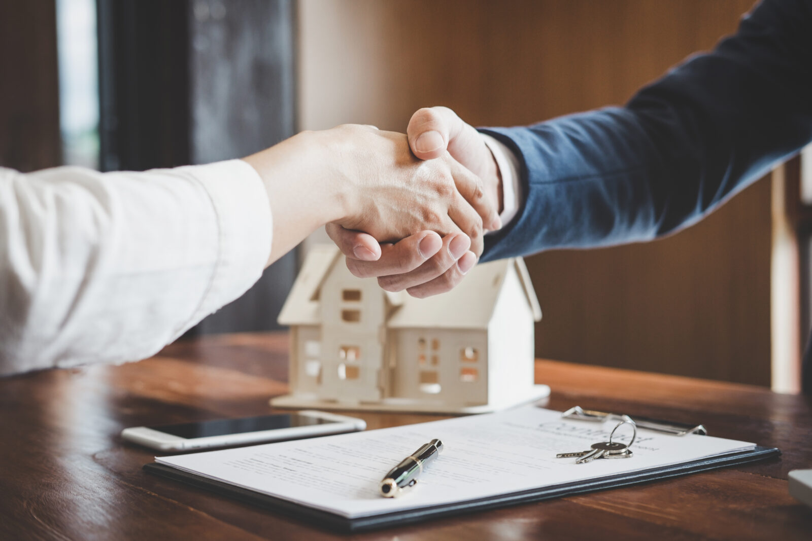 shaking hands over real estate deal
