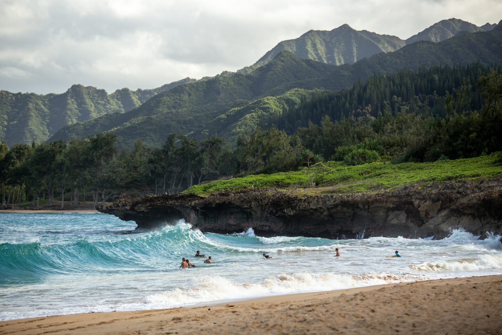 hawaii beach and oceanfront with mountains in the background