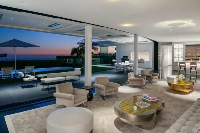 curved living room with pocketing walls of glass in trousdale