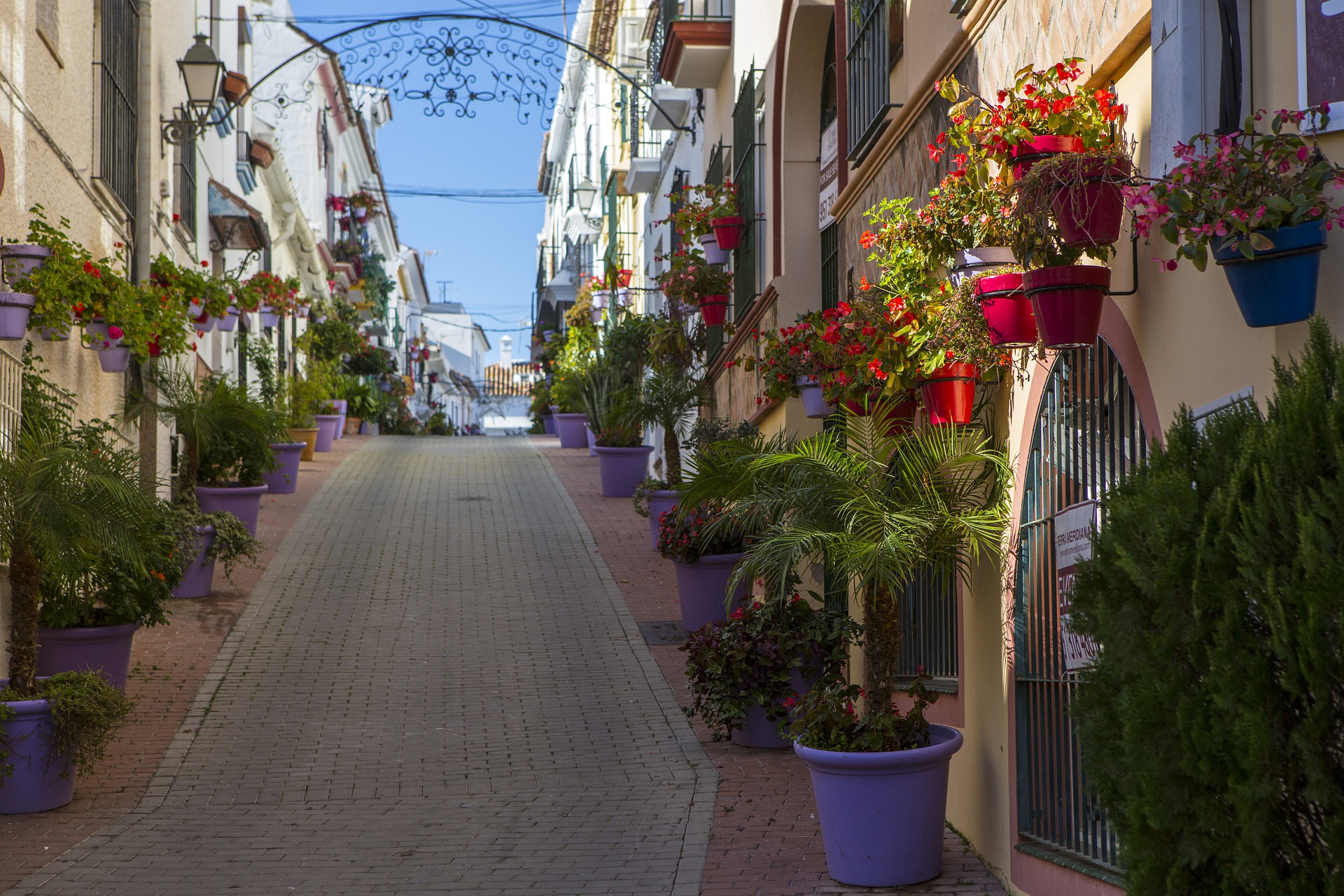 cobblestone road with shops and buildings in costa del sol spain