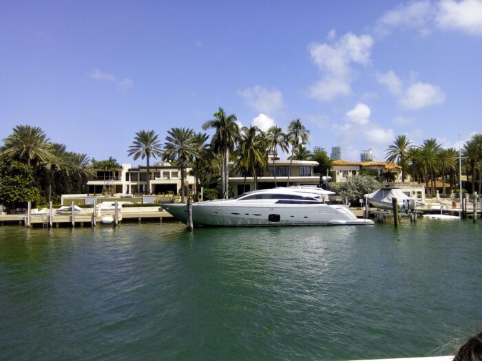luxury homes and a yacht on the waterfront in florida