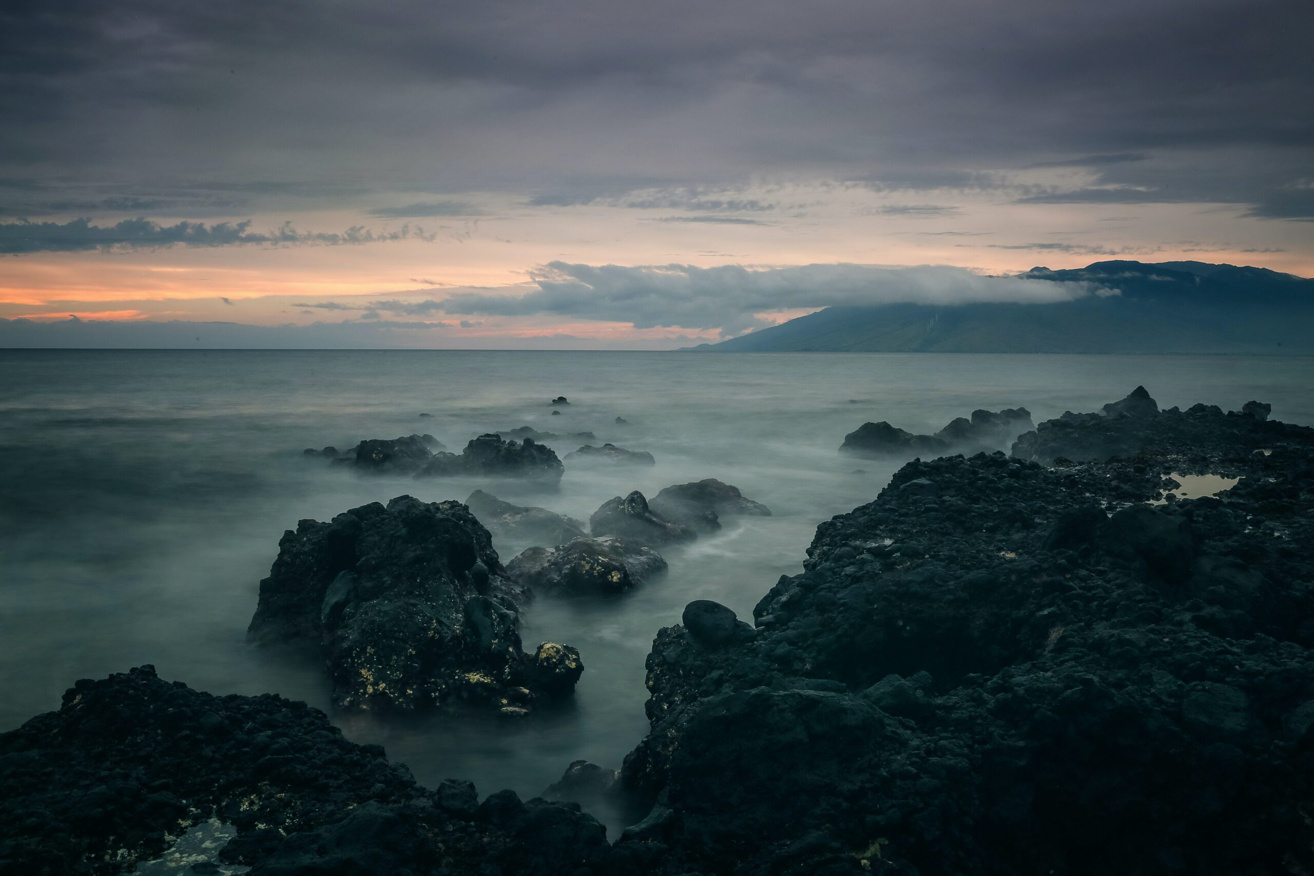 rocks and sea in hawaii at dusk