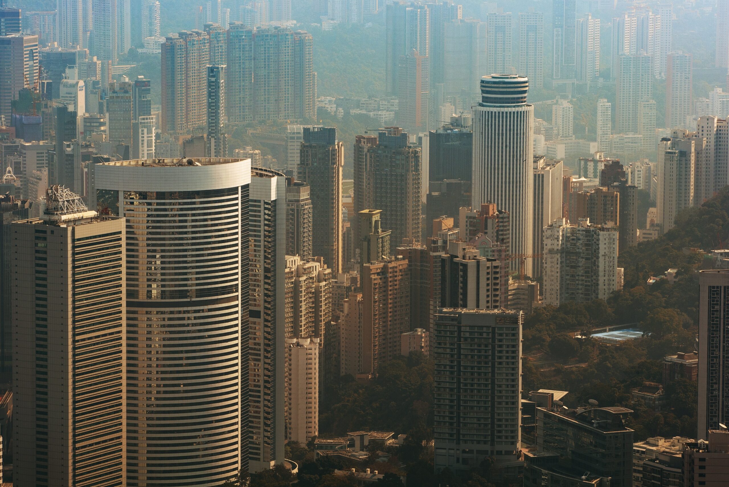 aerial view of hong kong residential towers around a park