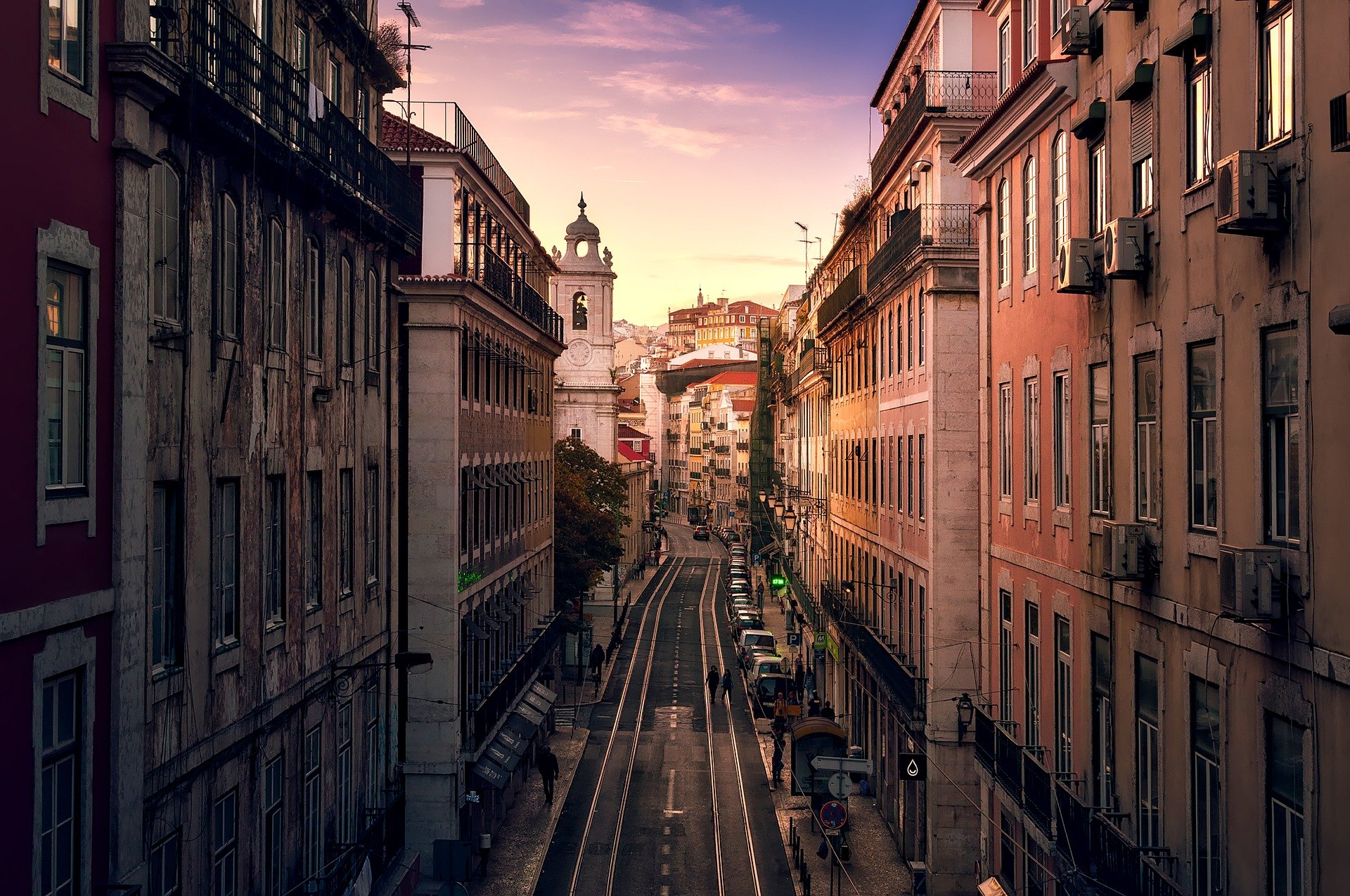 looking down a historic street corridor in the city of lisbon, portugal