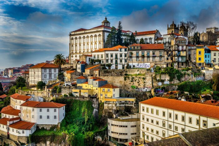 aerial view of porto in portugal with blue skies and historic buildings
