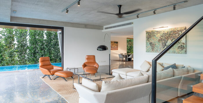 living room inside an industrial-style semi-detached house in singapore's bukit timah area