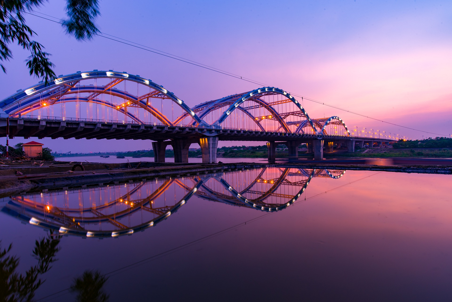 modern bridge leading across to city in vietnam