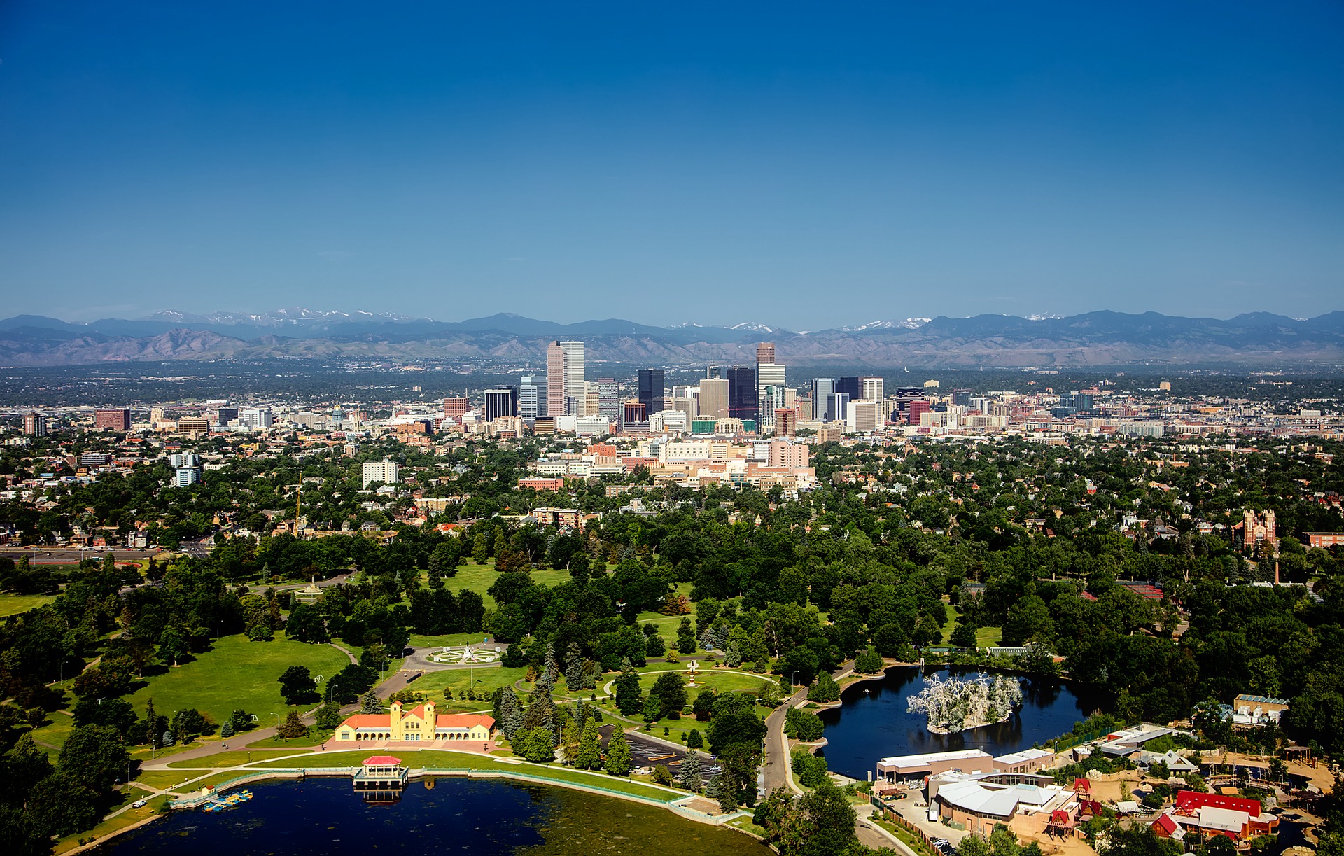denver skyline and downtown area with lakes in the foreground