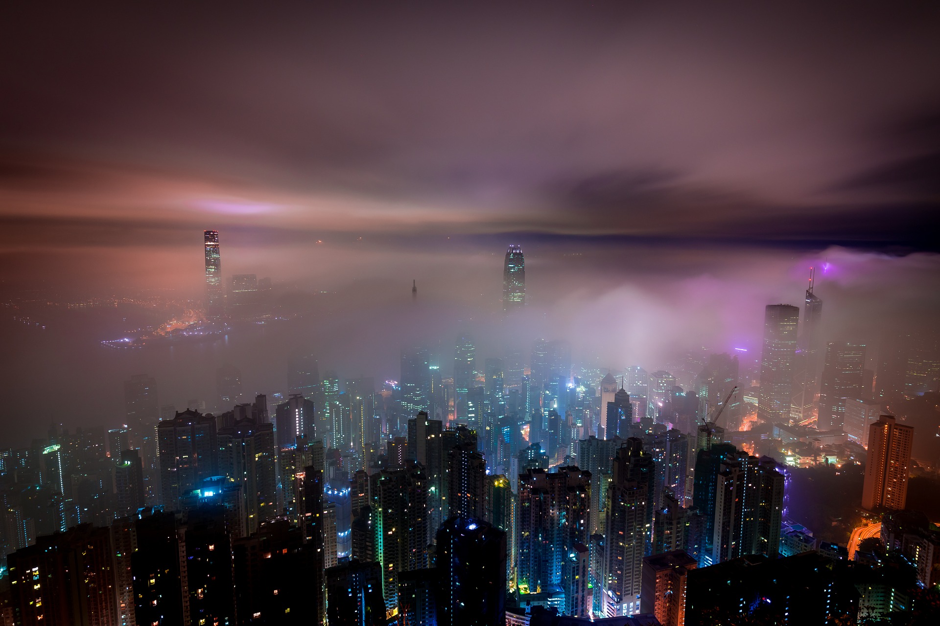 hong kong skyline with fog blocking view at night