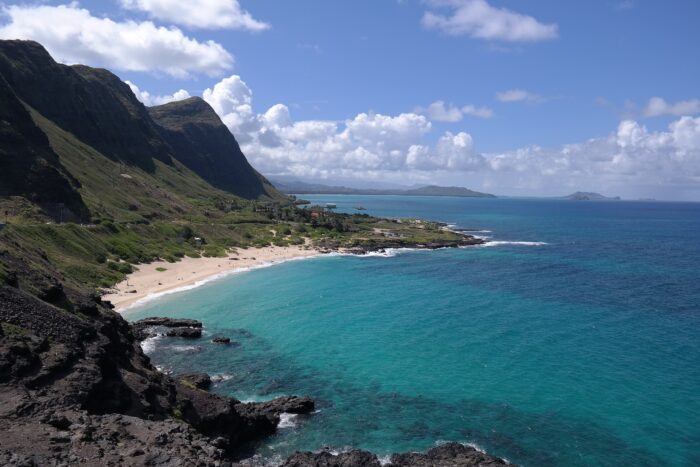 honolulu coastline and cove with blue waters and tropical beachfront