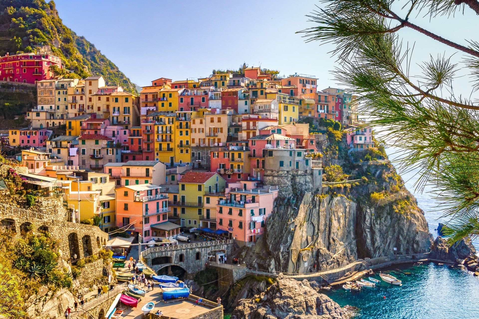 Colorful homes along the hillside overlooking a cove in Italy