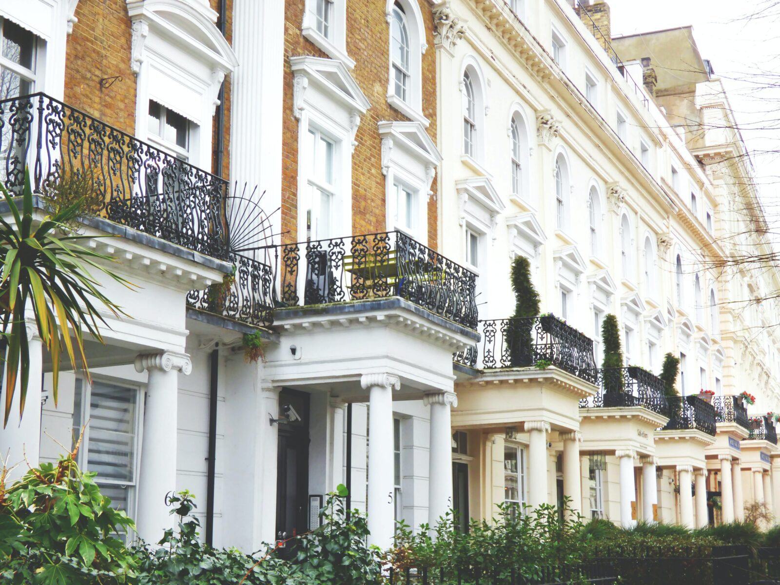 row homes in a burrough of london, united kingdom, with balconies and covered porches