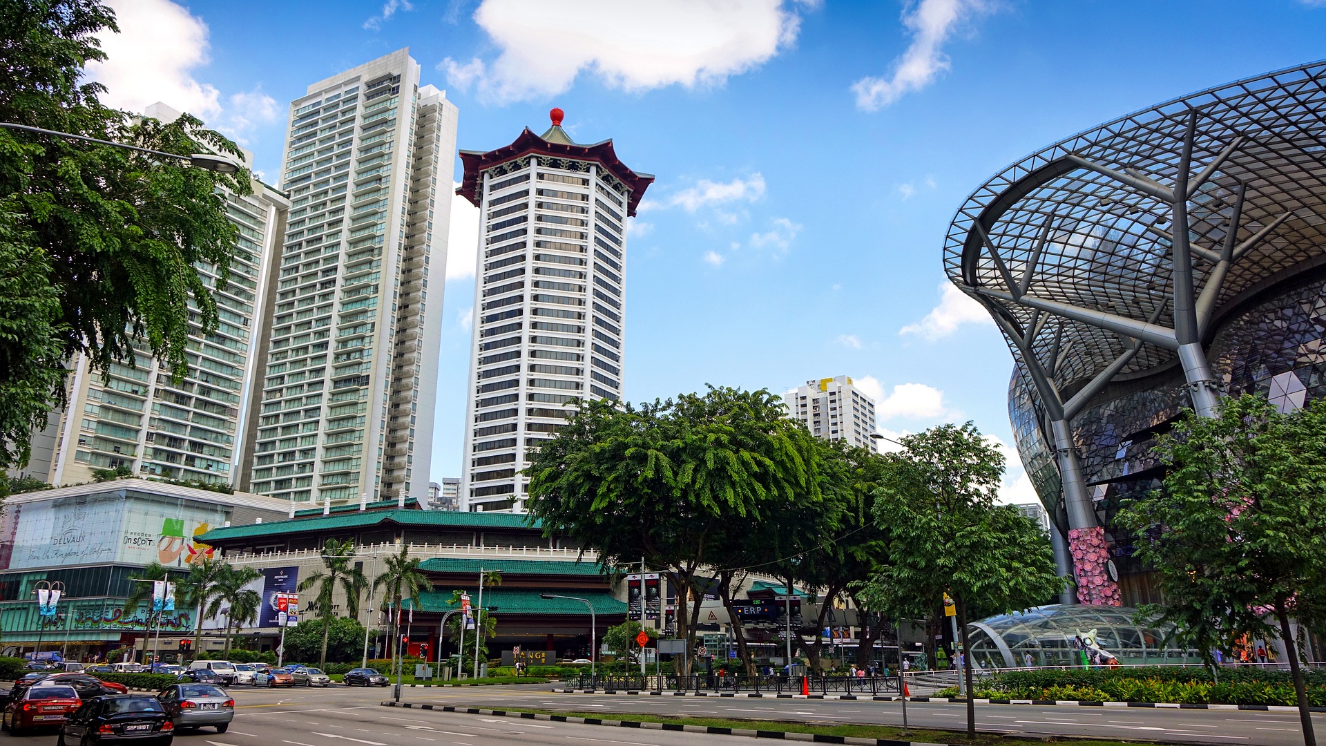 orchard road in singapore with shops and skyscrapers