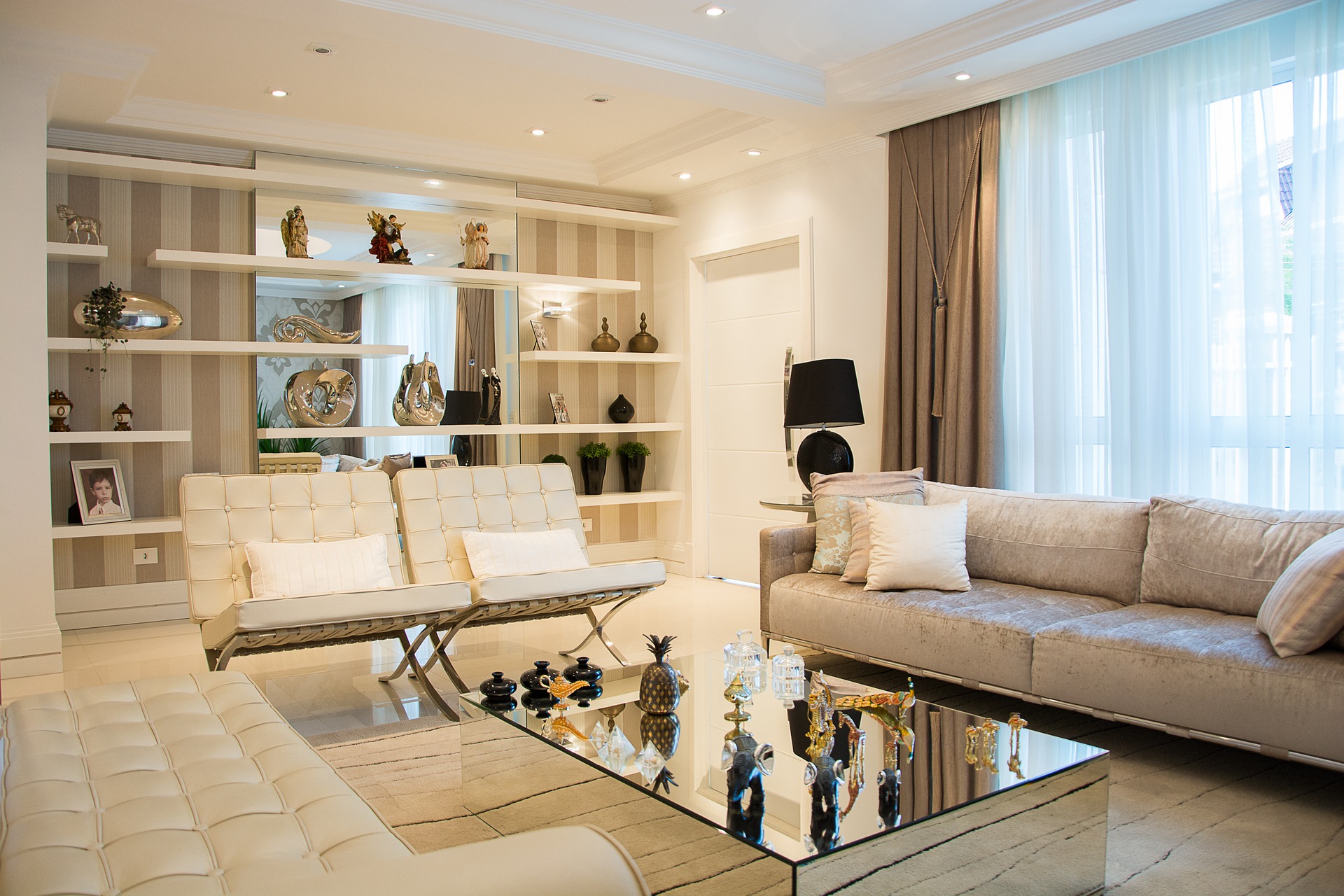 white-hued living room with staged furniture and decor