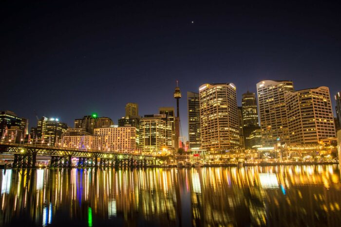 sydney australia skyline at night reflected against the water