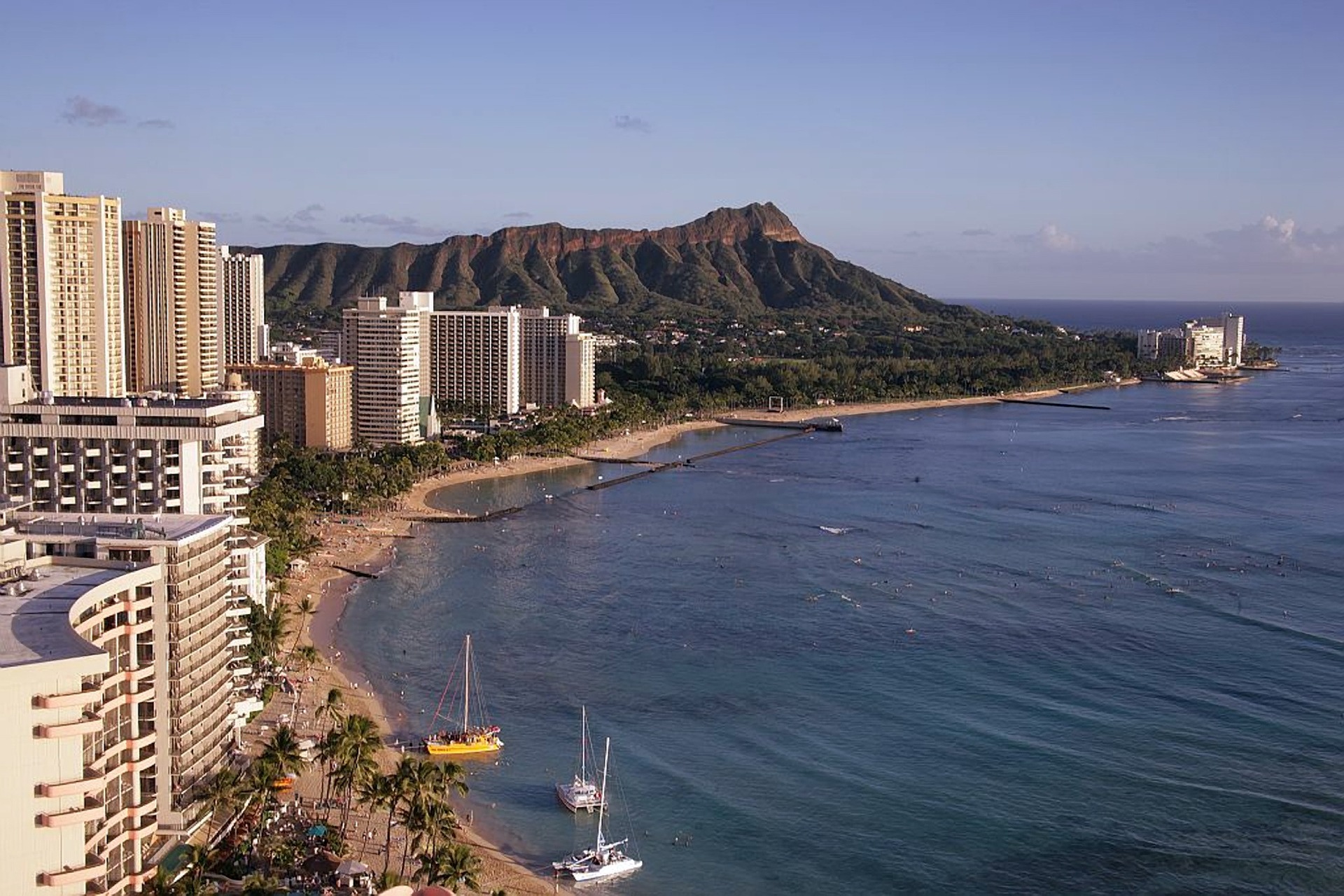 honolulu coastline with residential towers and hotels and boats