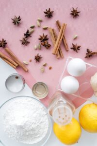 cooking ingredients laid out on a pink background