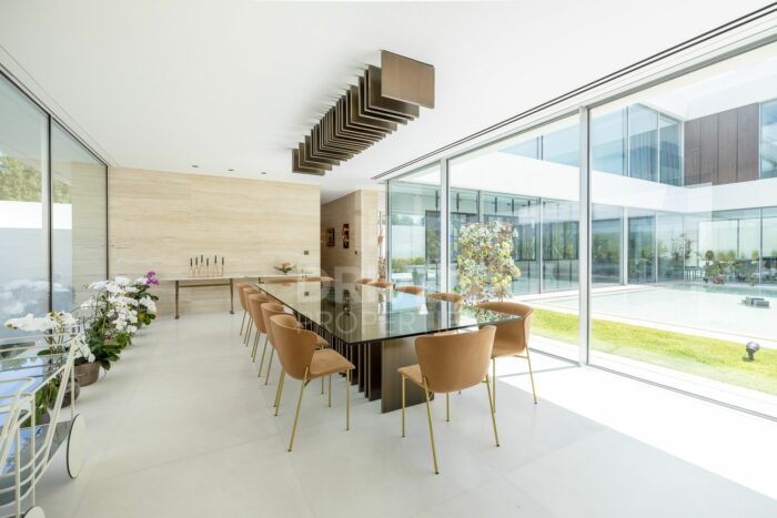walls of glass enclose a formal living room at a dubai mansion