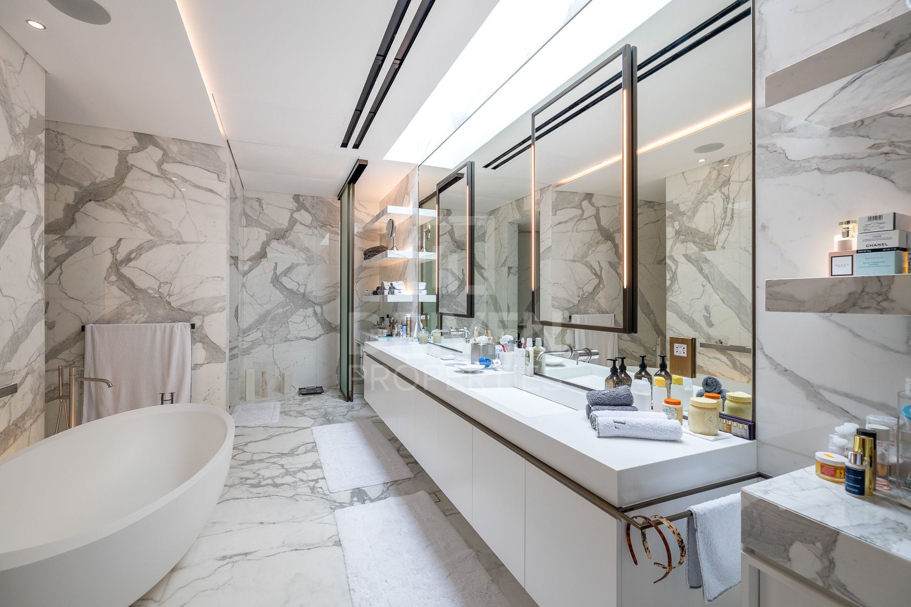 luxurious dubai bathroom with white marble and a soaking tub