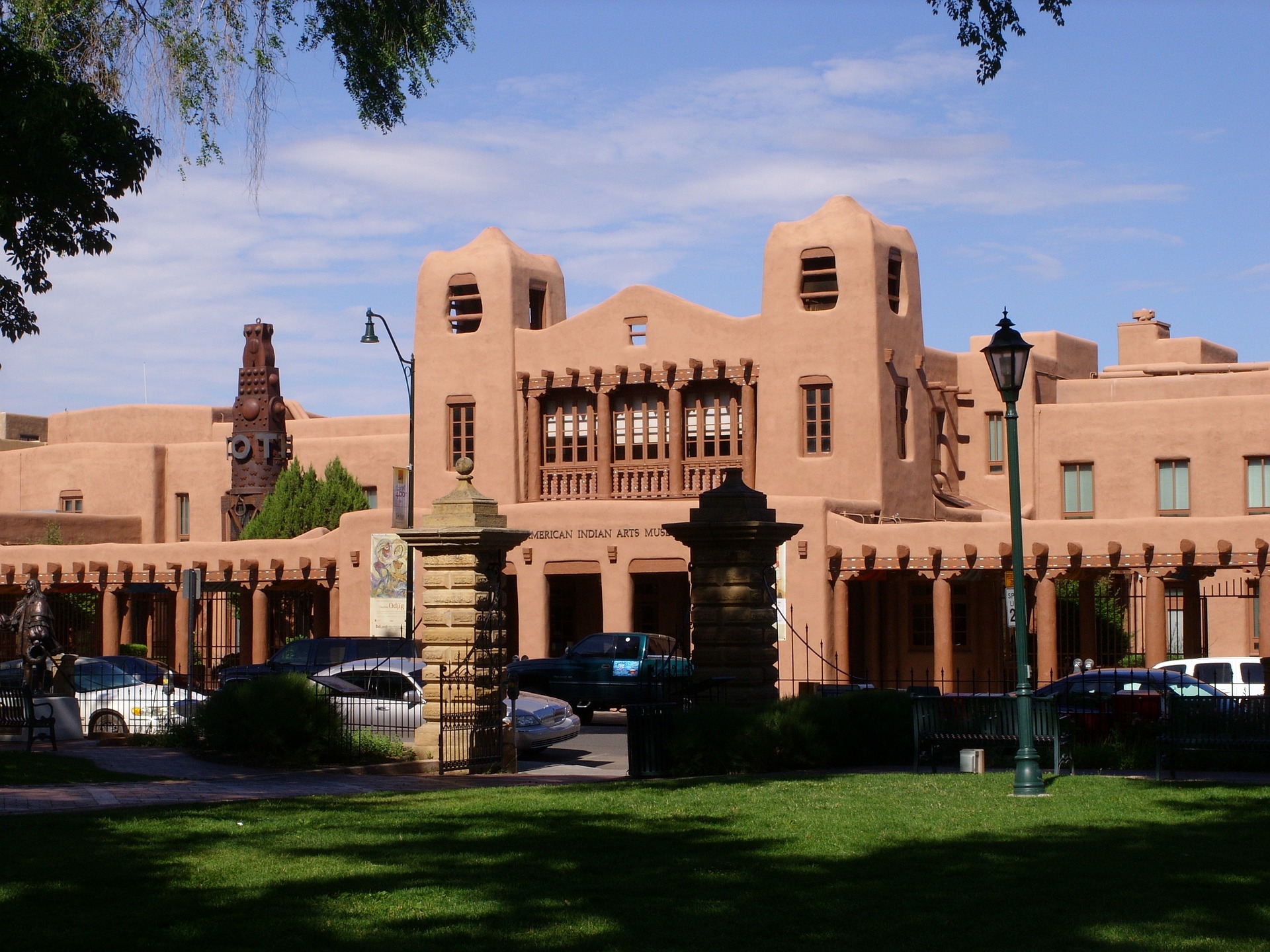 a historic landmark building in new mexico with a park in the foreground