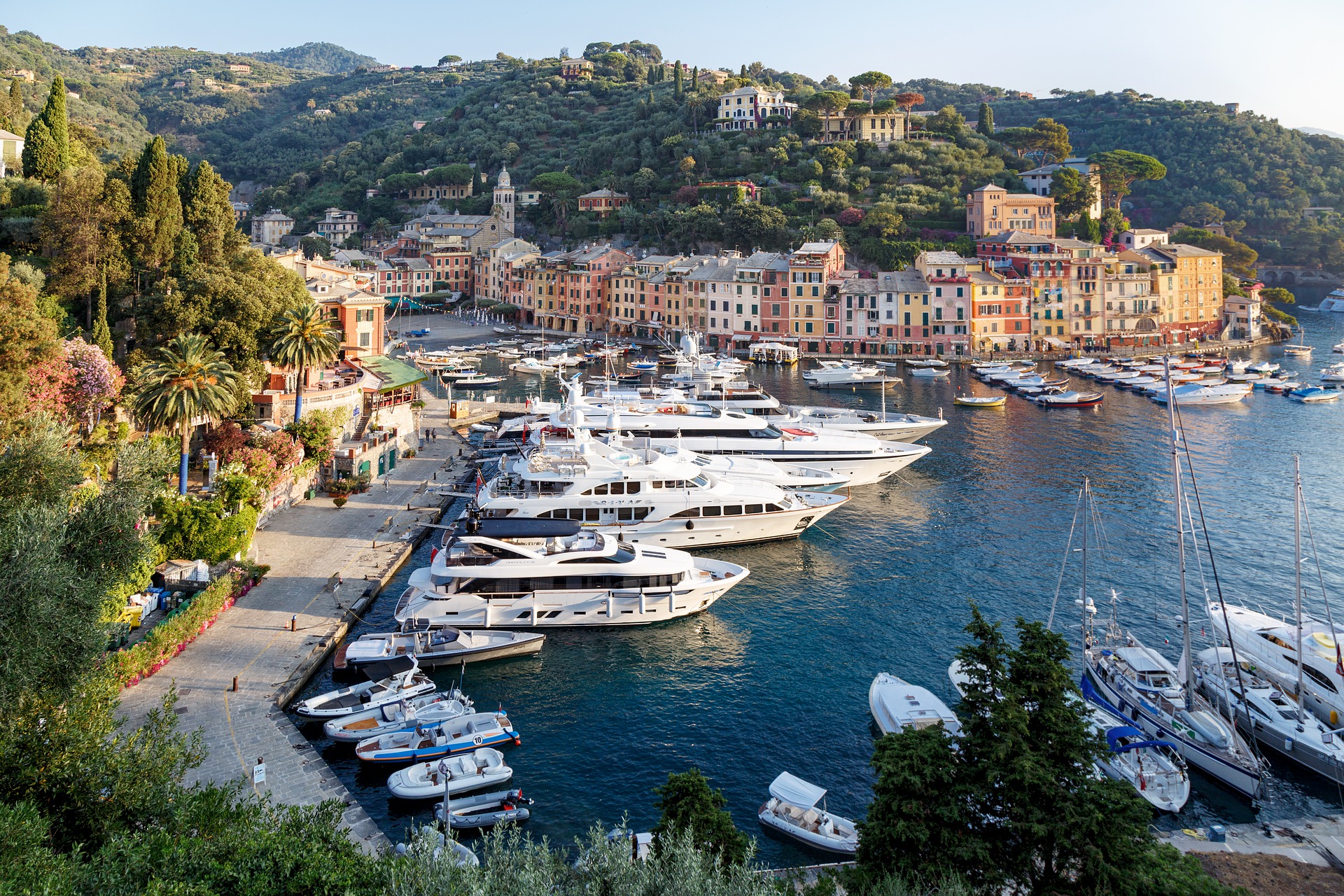 portofino liguria harbor with fancy yachts and expensive hillside homes