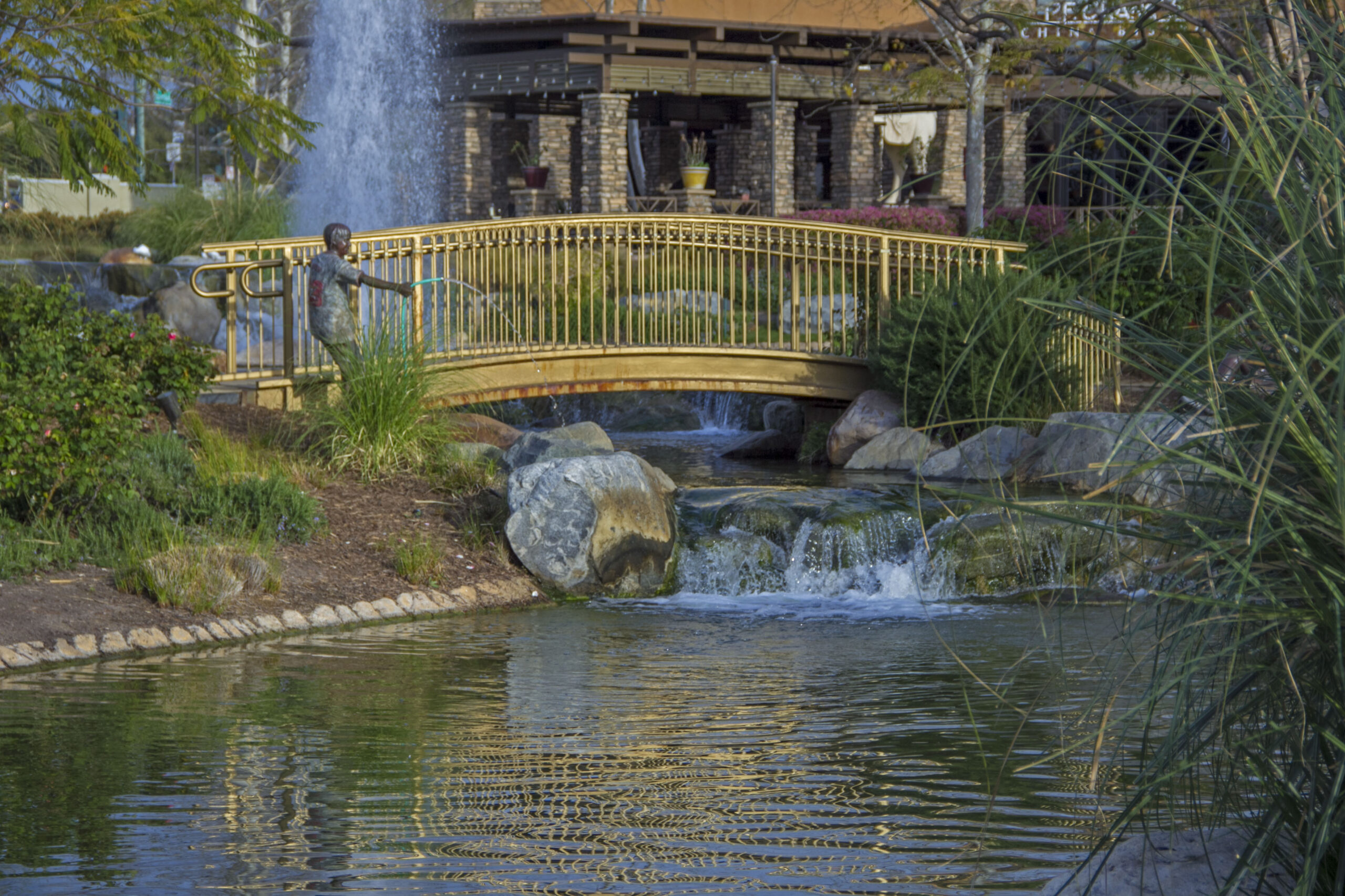 westlake village promenade fountain with bridge and shops in the background