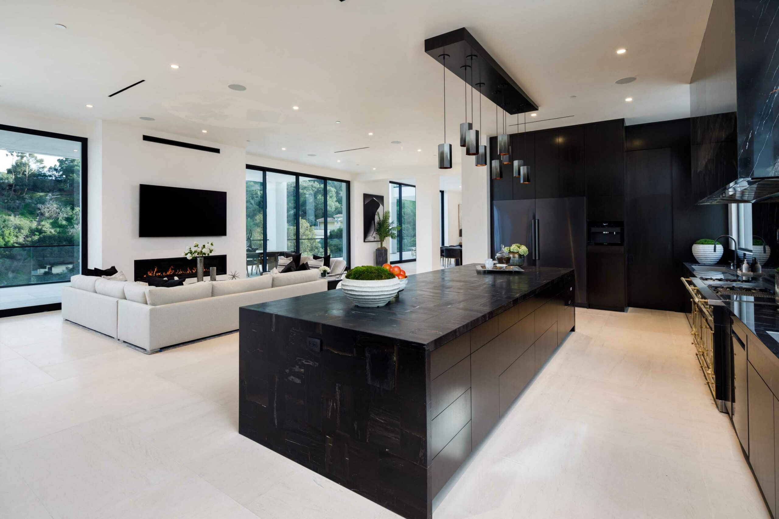 modern kitchen with black cabinetry and appliances