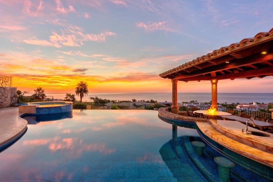 Pool overlooking the ocean and sunset