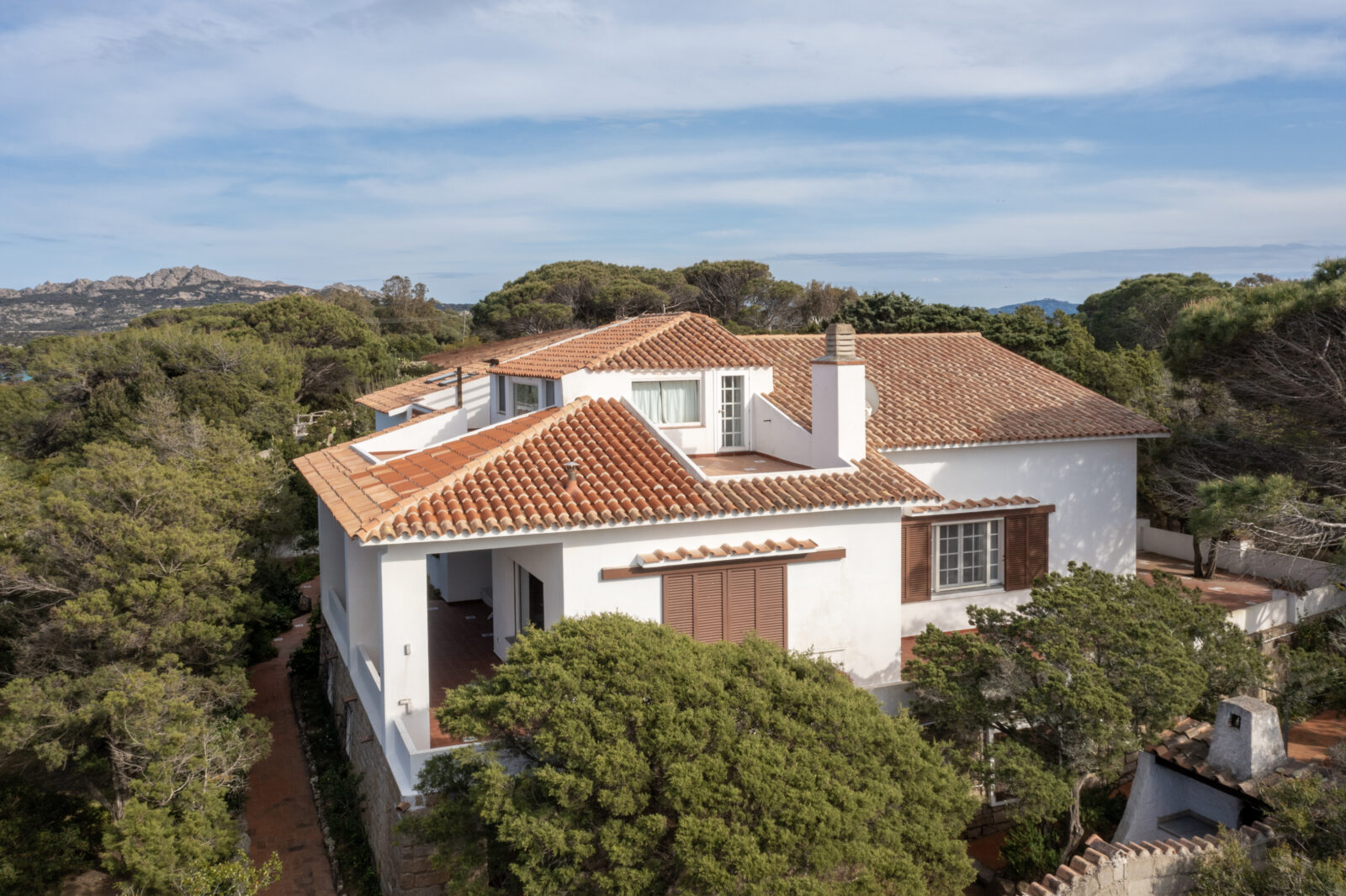 exterior view of the home with nature in the background