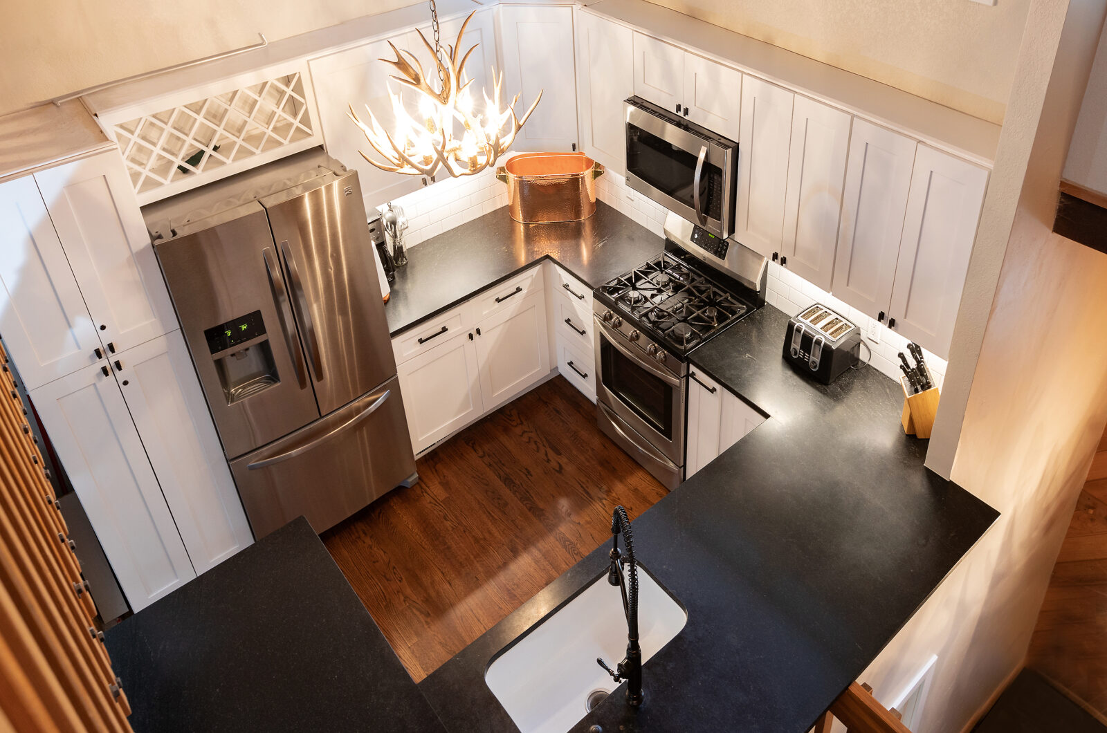 overhead view of a cozy kitchen with black accent details.