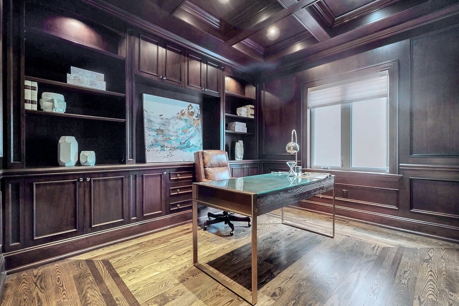 interior view of a home office with dark built in shelving 