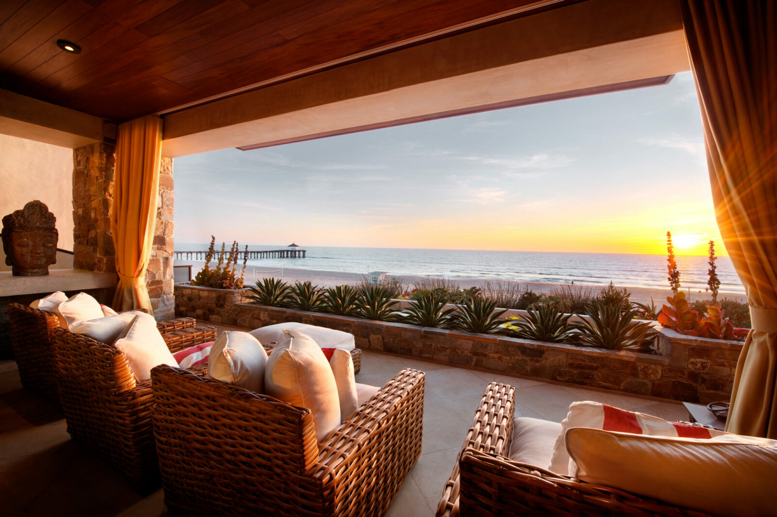 Elevated 20 feet above the beach, this luxurious three-level home in Manhattan Beach is listed for sale at US $18.25 million by Strand Hill