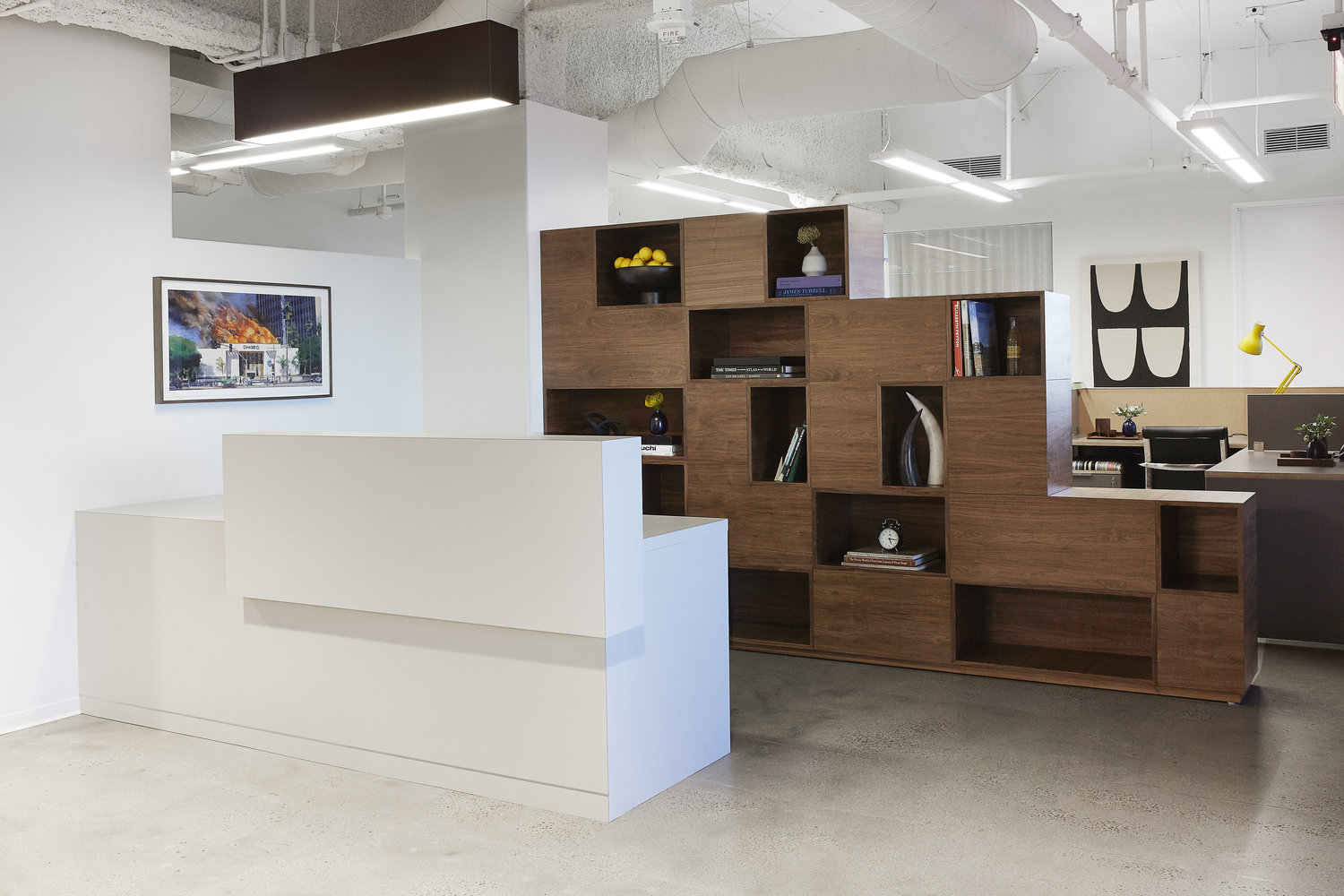 interior view of an office front desk with a modular bookcase behind