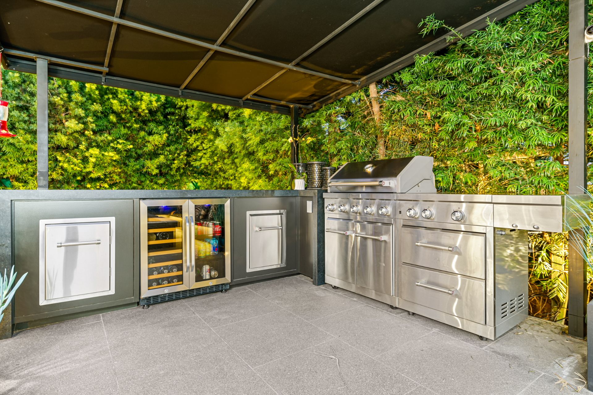 exterior view of the outdoor kitchen with stainless steel appliances