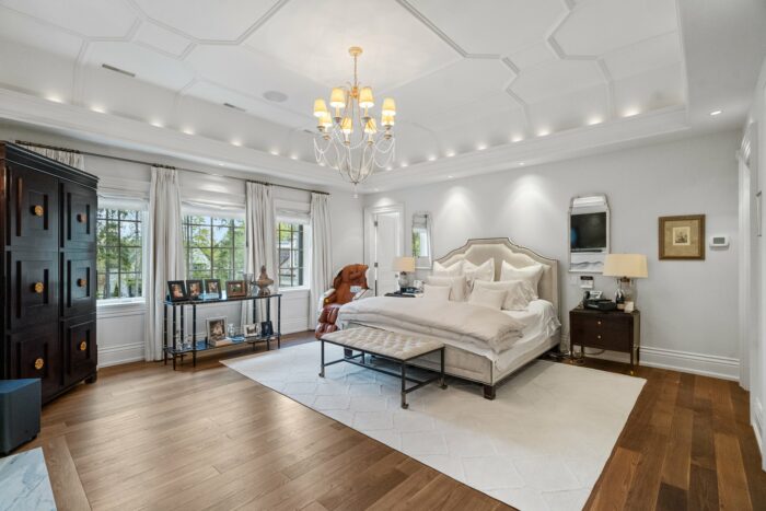Sizable upstairs bedroom with elaborate ceiling detail. 