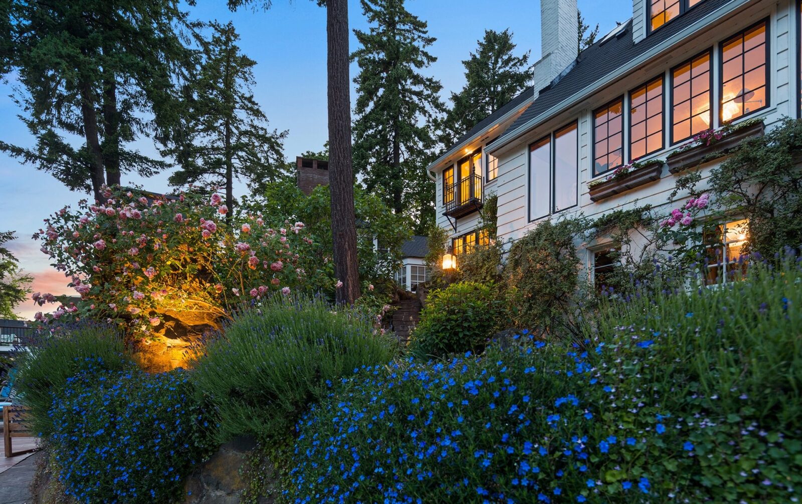 Oregon Lake Cottage Surrounded By Flowering Hedges
