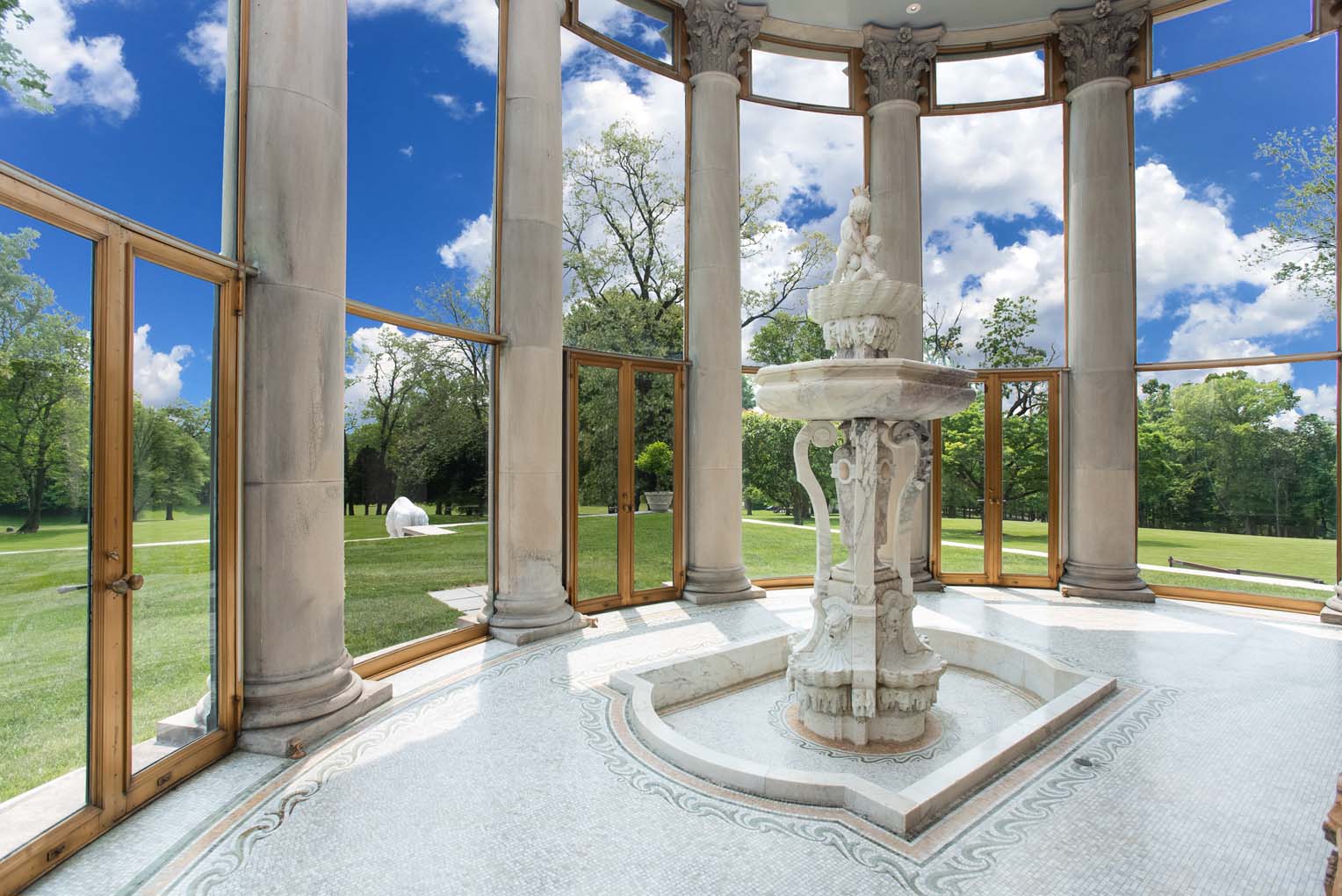 Portico Solarium With Floor To Ceiling Glass And Statuary