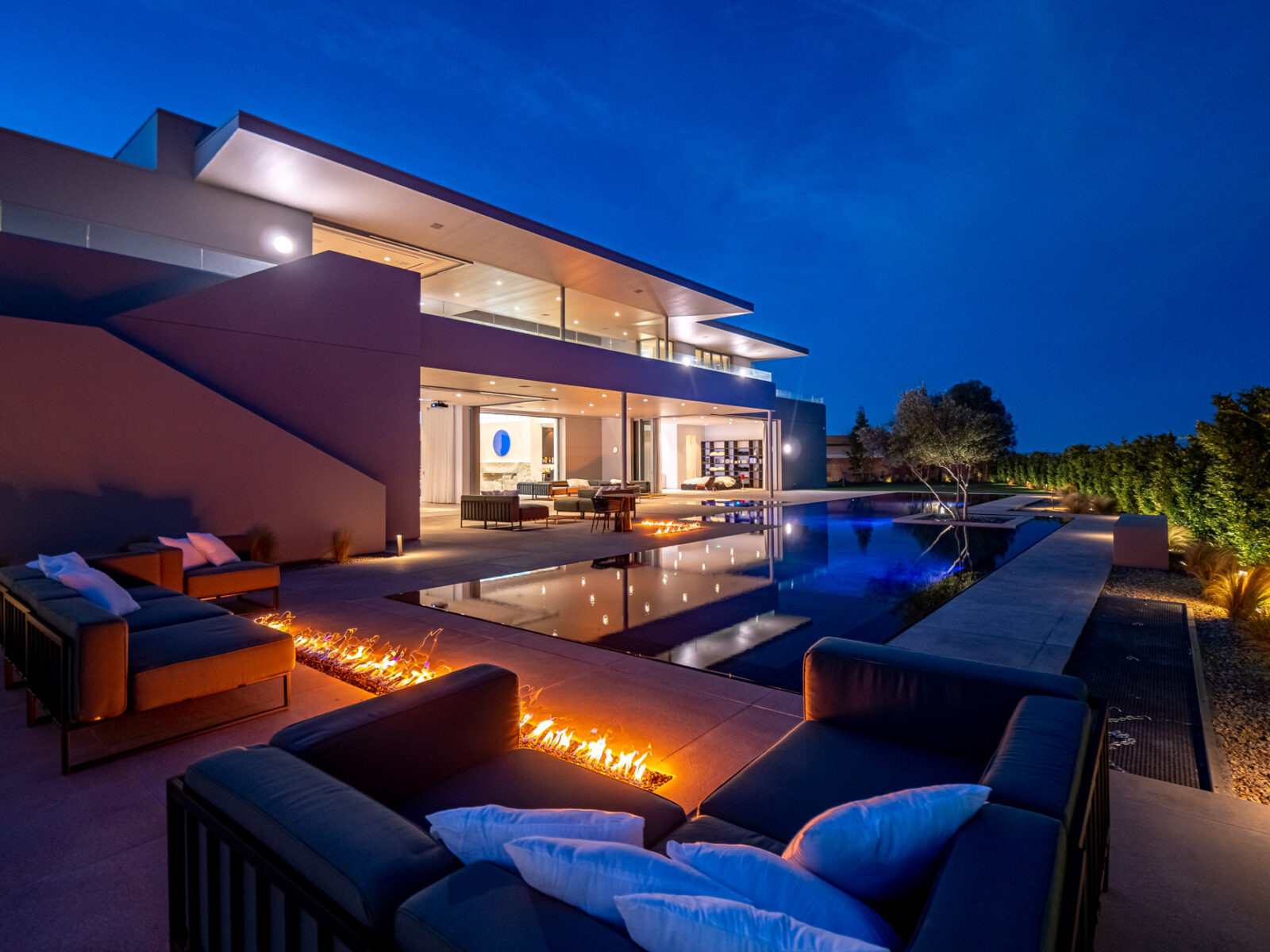 Fireplace And Swimming Pool At Night At An Ultra-Modern Las Vegas Home