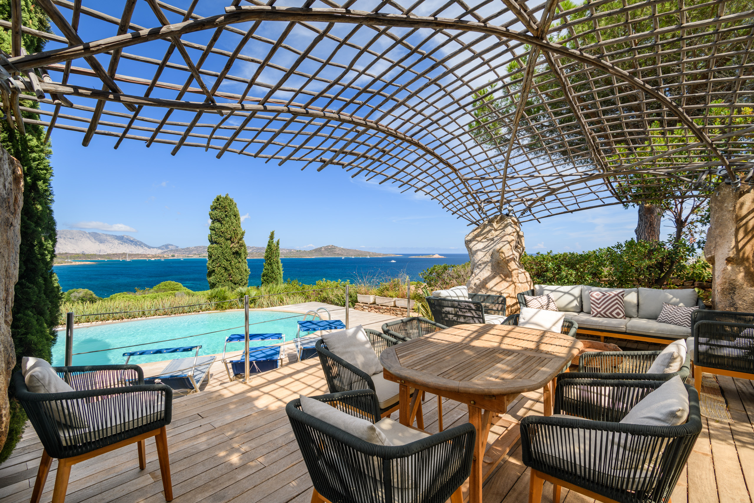 A pool overlooks the sea in Sardinia
