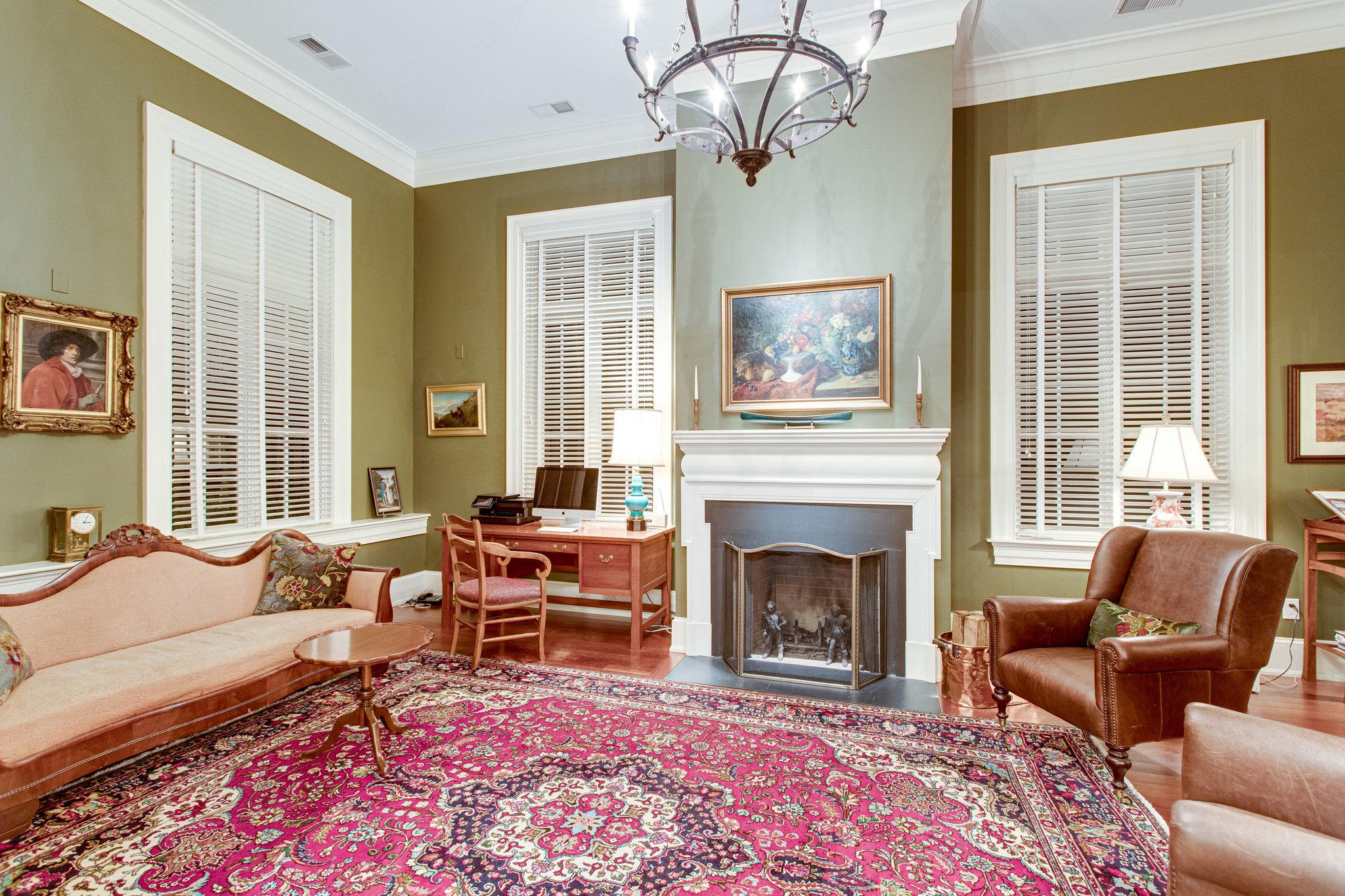 Living space with traditional millwork and fireplace. 