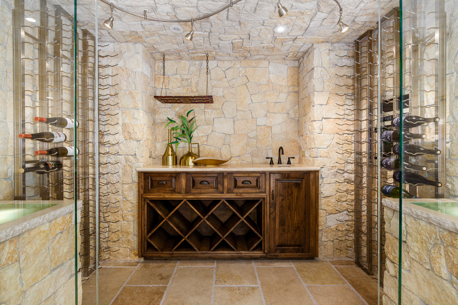Temperature-controlled wine room with stone walls. 