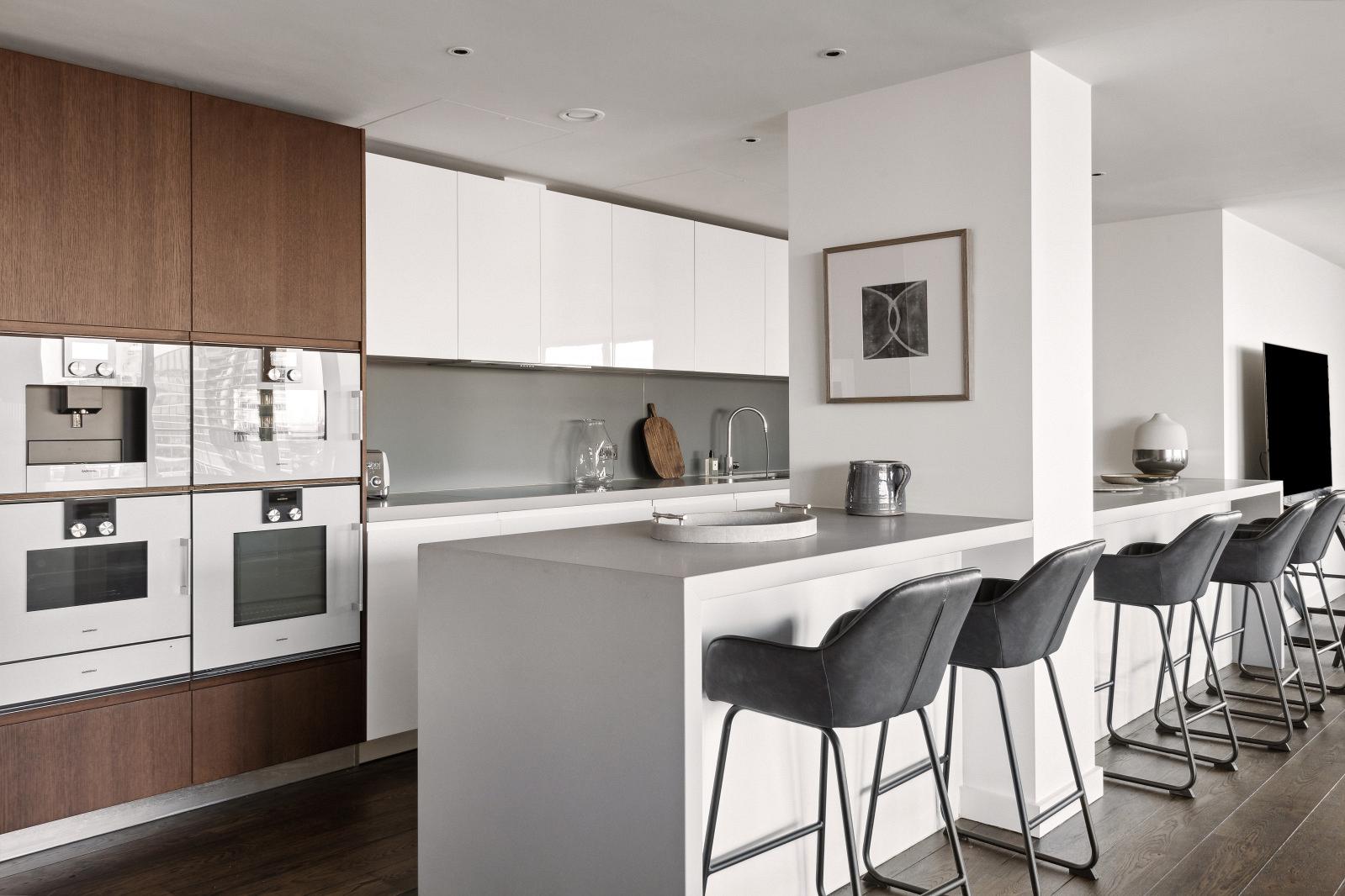 Ample seating in a sleek, modern kitchen. 