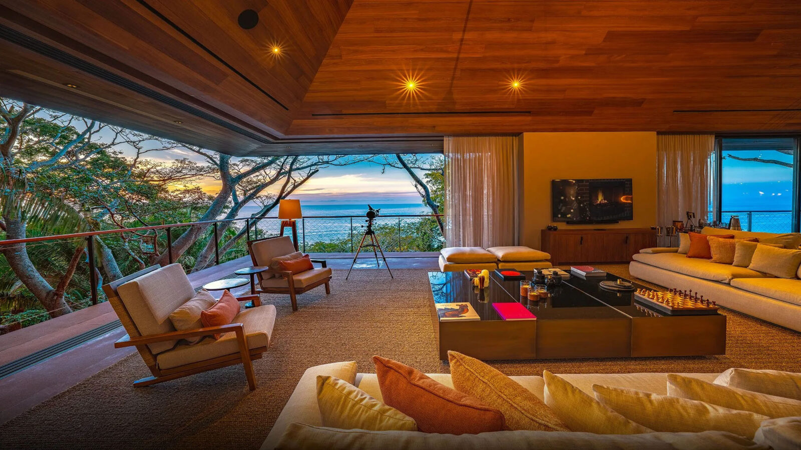 Movable walls of glass featuring views of the ocean. 
