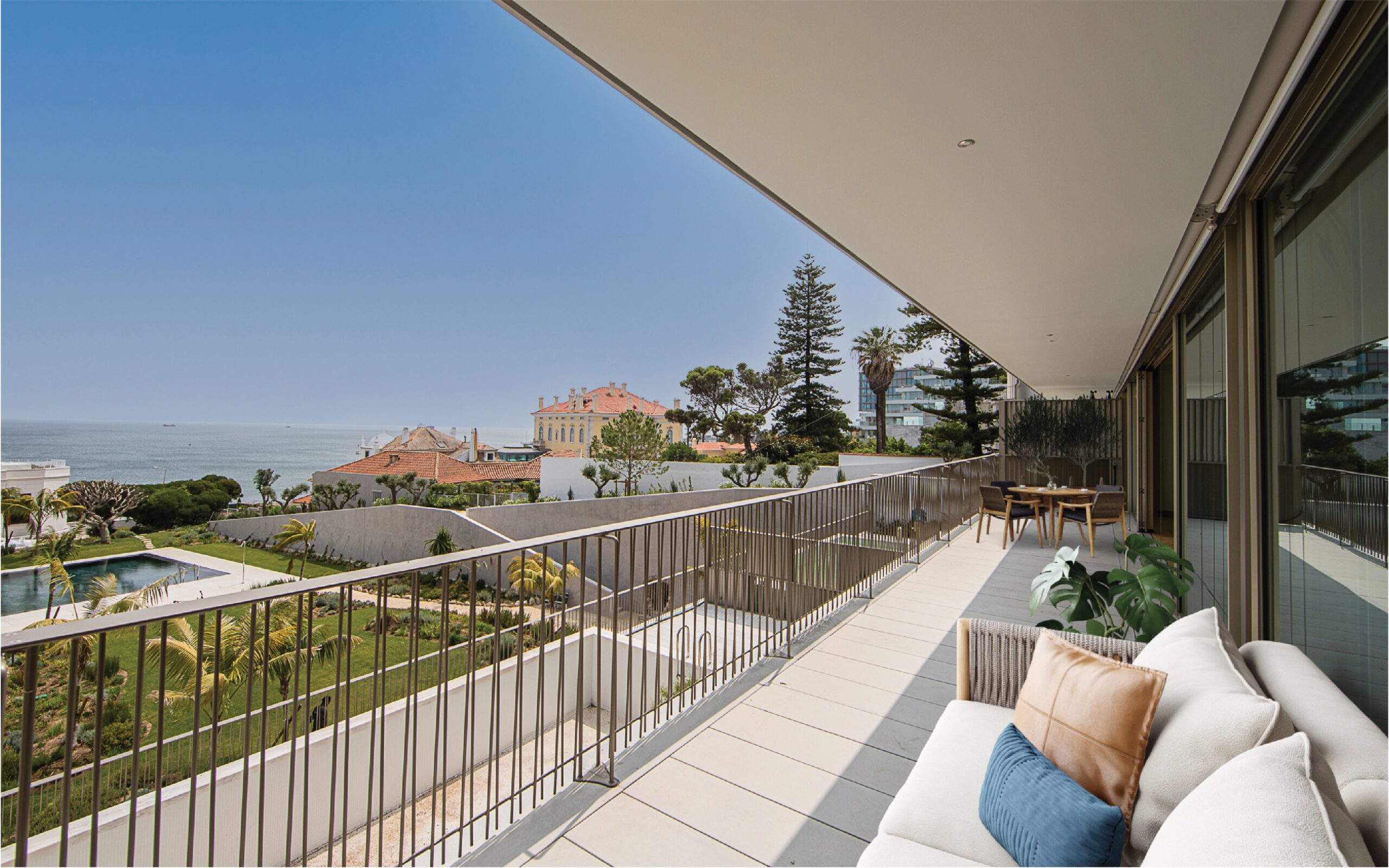 A balcony of a nice apartment with a view of other houses.