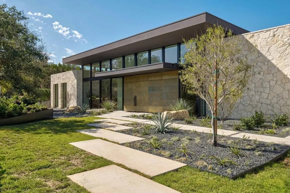 Modern home in Austin with sharp lines and stone facade.