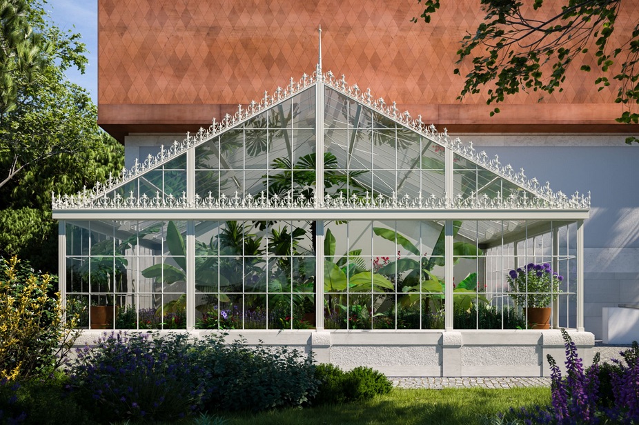 A greenhouse in front of a building with a red roof.